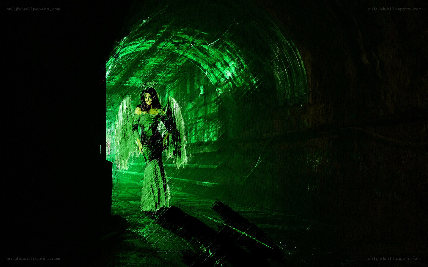angel in green-lit tunnel