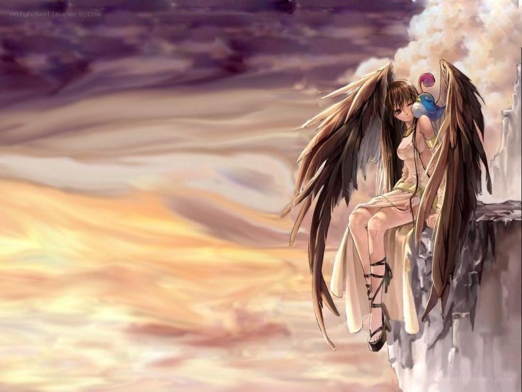 angel on a cliff at sunset