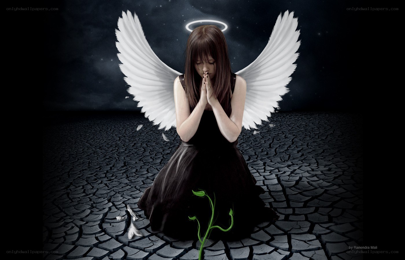 angel praying on cracked earth