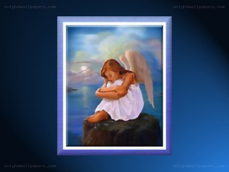 angel sitting on a rock