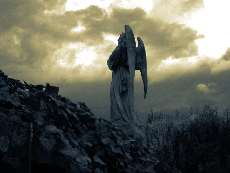Angel statue at sunset