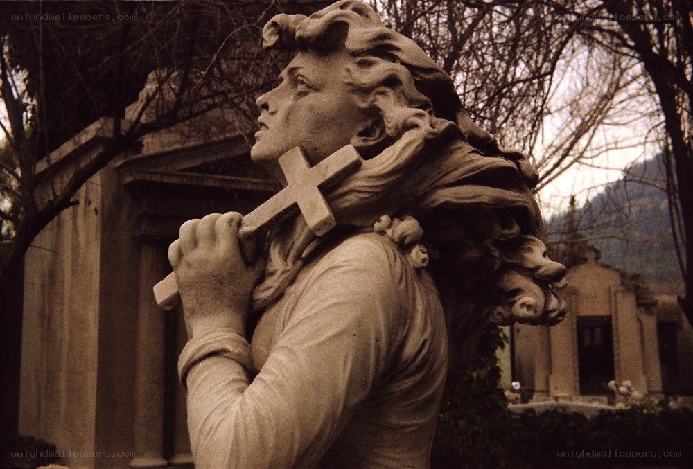 Angel statue holding a cross