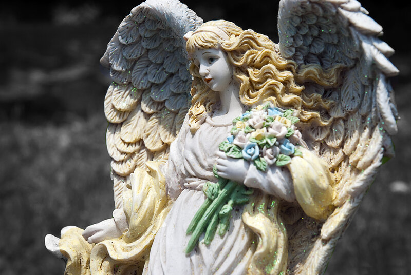 Angel Statue Holding Flowers