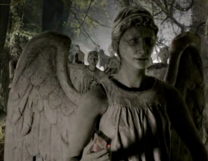 Angel statue in a forest