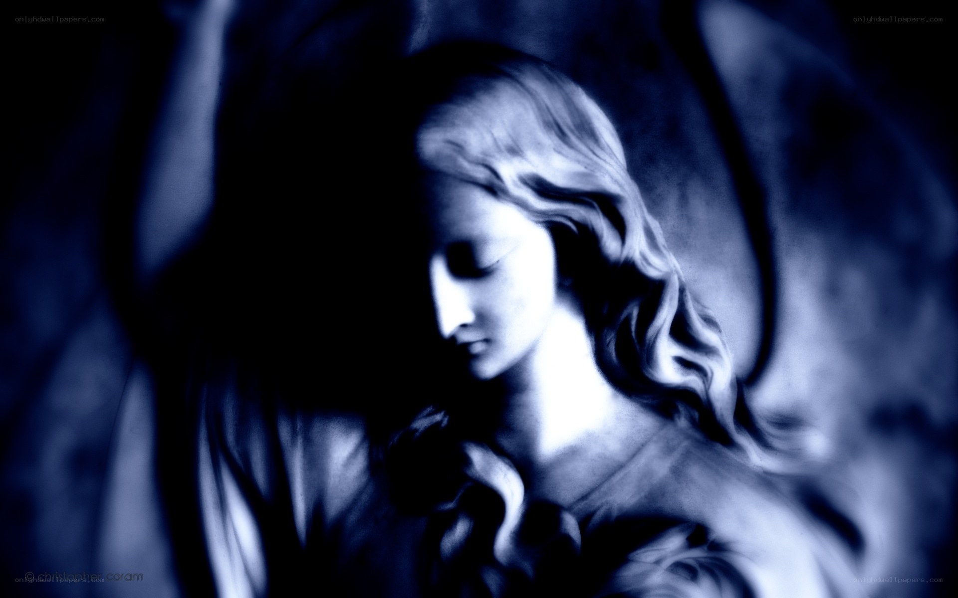 angel statue in blue light
