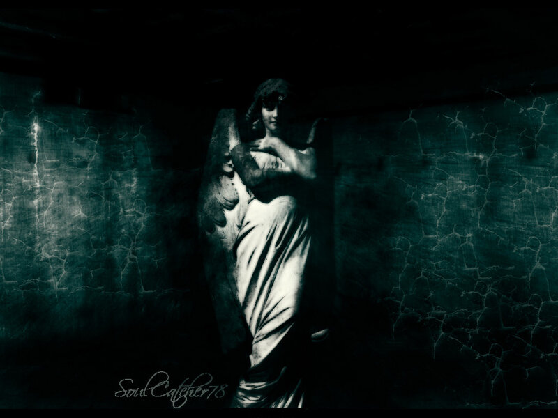 angel statue in dark corridor
