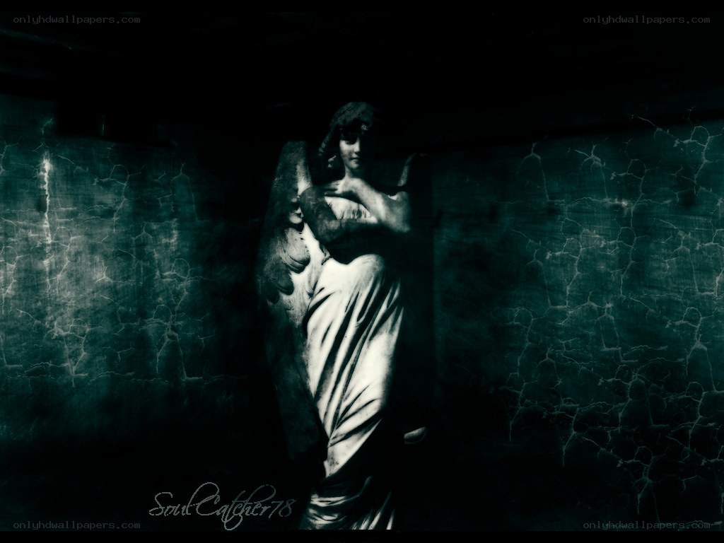 angel statue in dark corridor