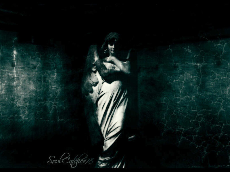 angel statue in dark setting