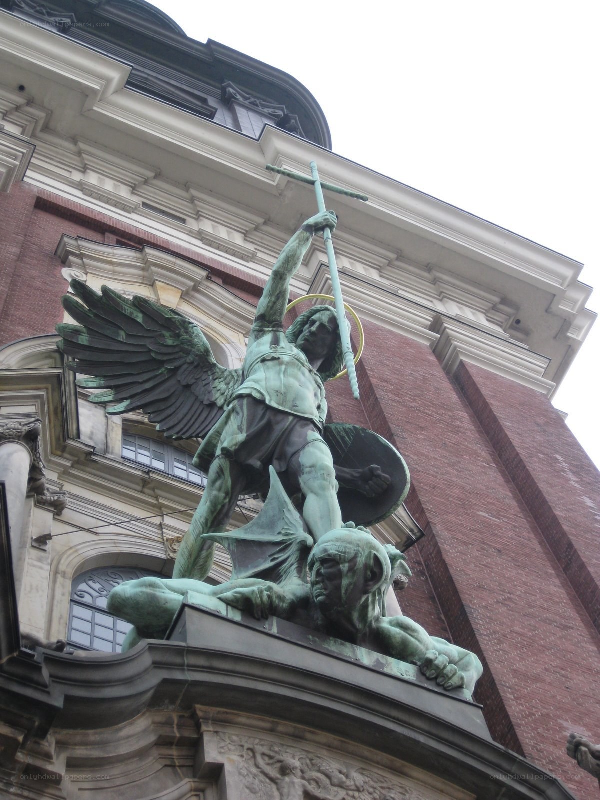 Angel statue on building facade