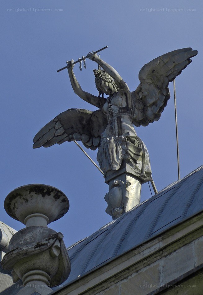 Angel statue on building roof