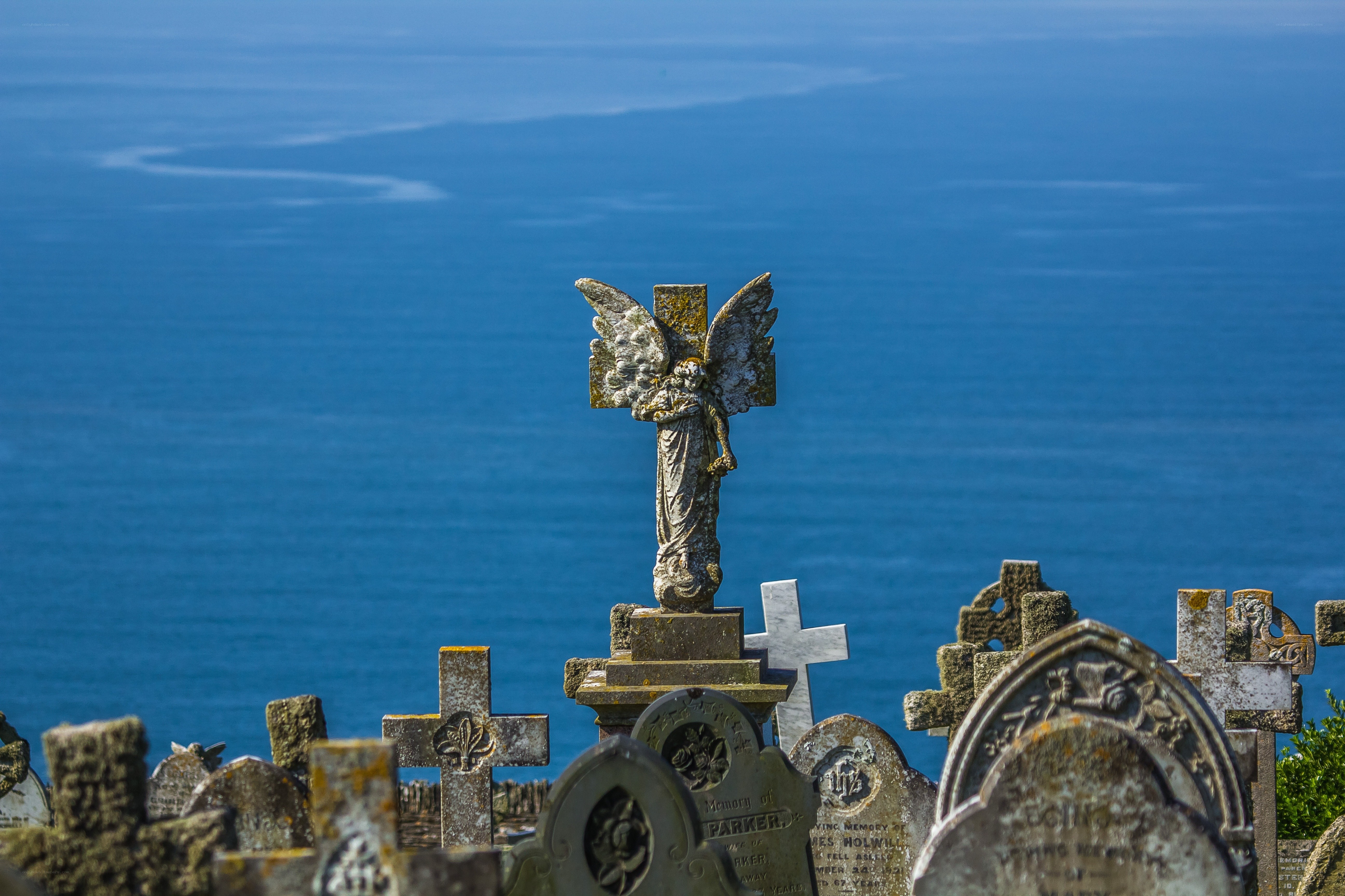 Angel statue overlooking the sea