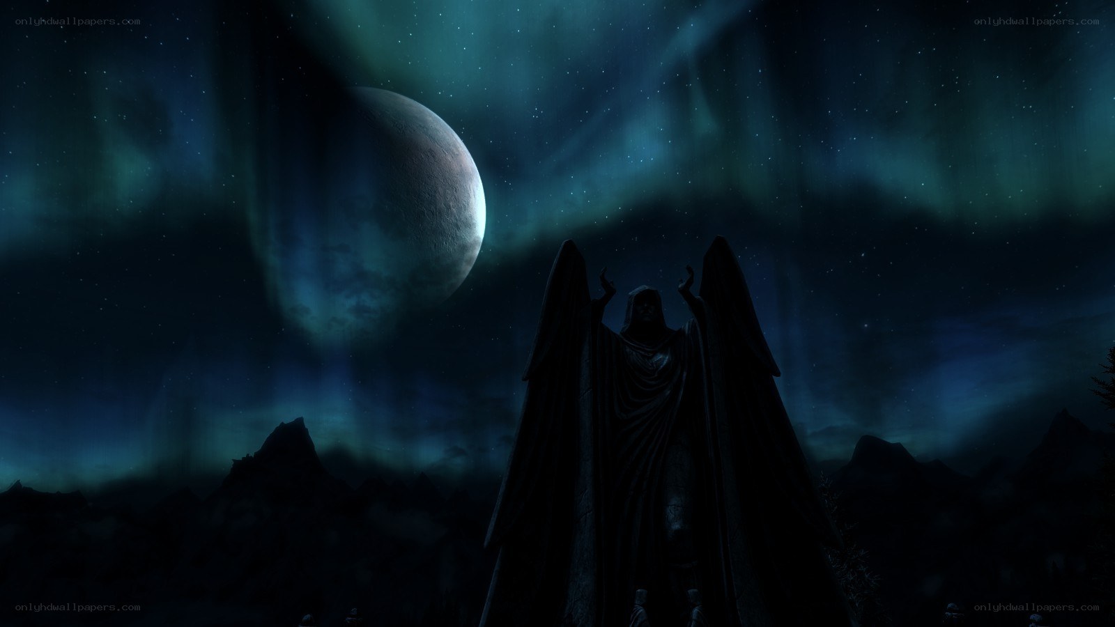 angel statue under aurora
