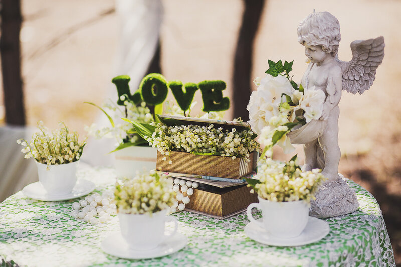 Angel Statue with Flowers — White, Serene, Afternoon