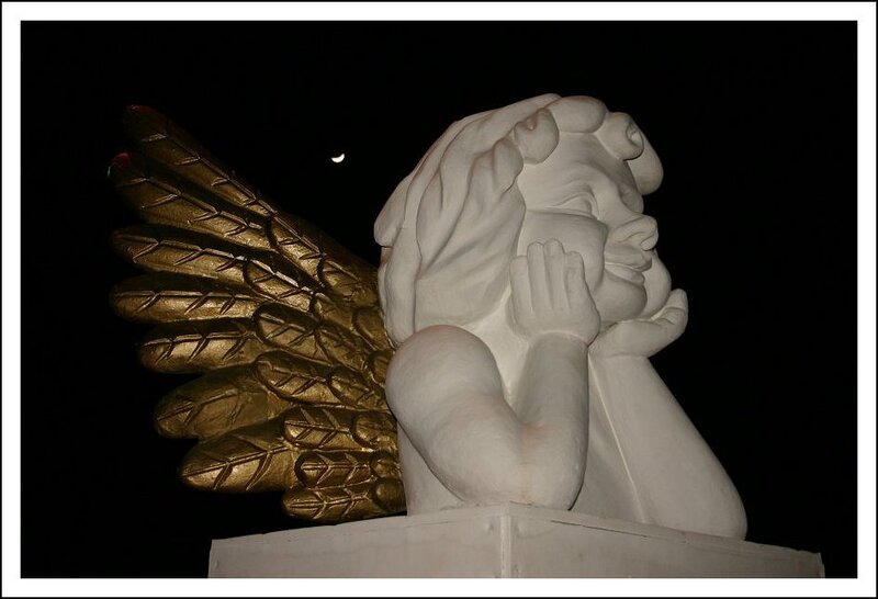 angel statue with golden wings