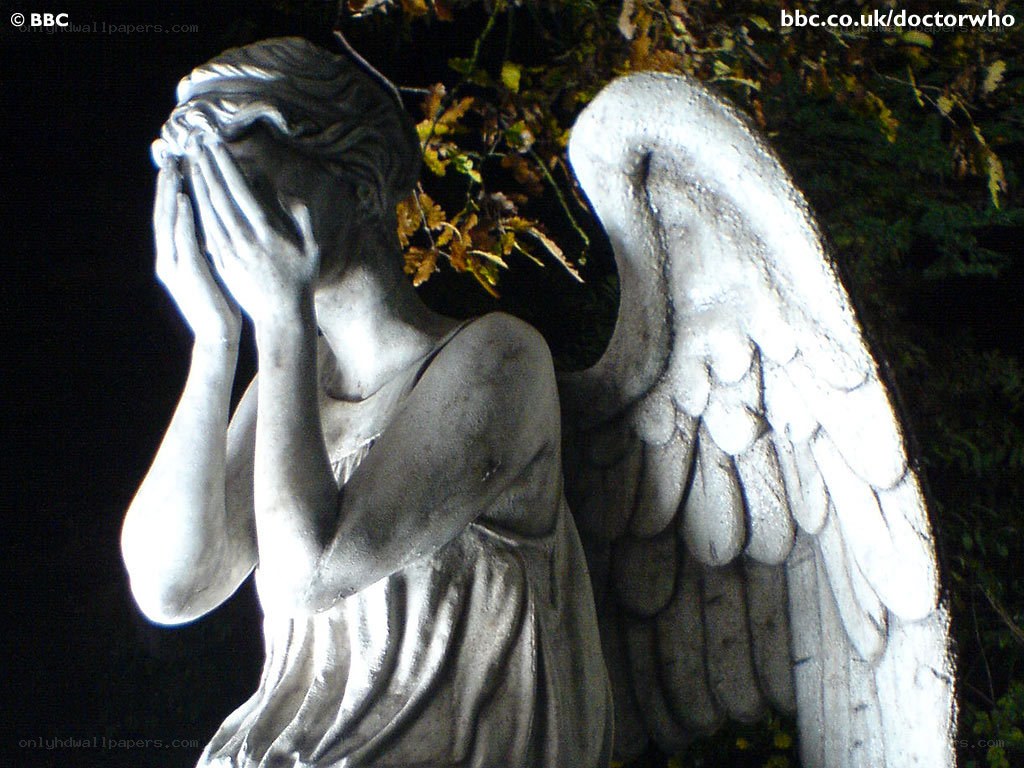 angel statue with hands covering face
