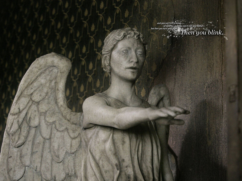 angel statue with text