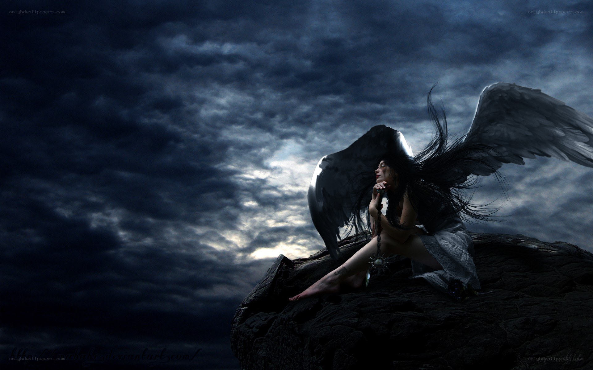 angel with black wings on cliff