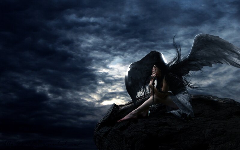 angel with black wings on cliff