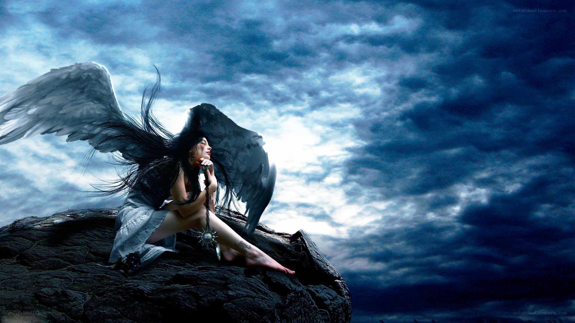 Angel with dark wings on cliff