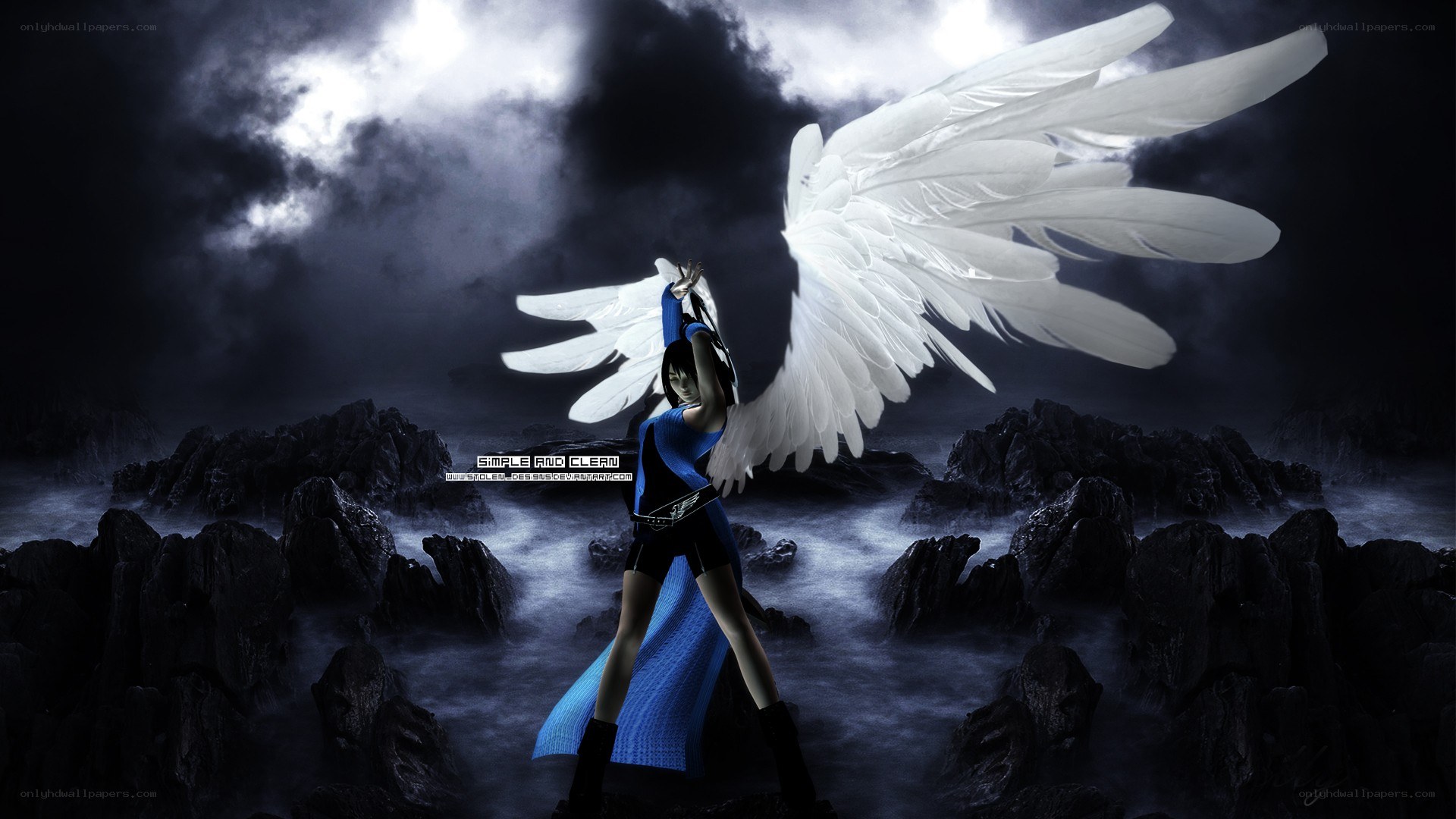 Angel with white wings on rocks