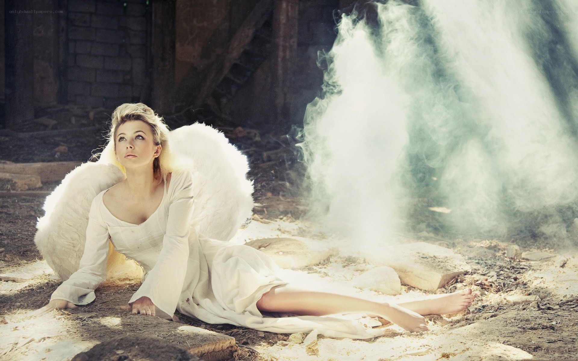 angel with wings in smoke