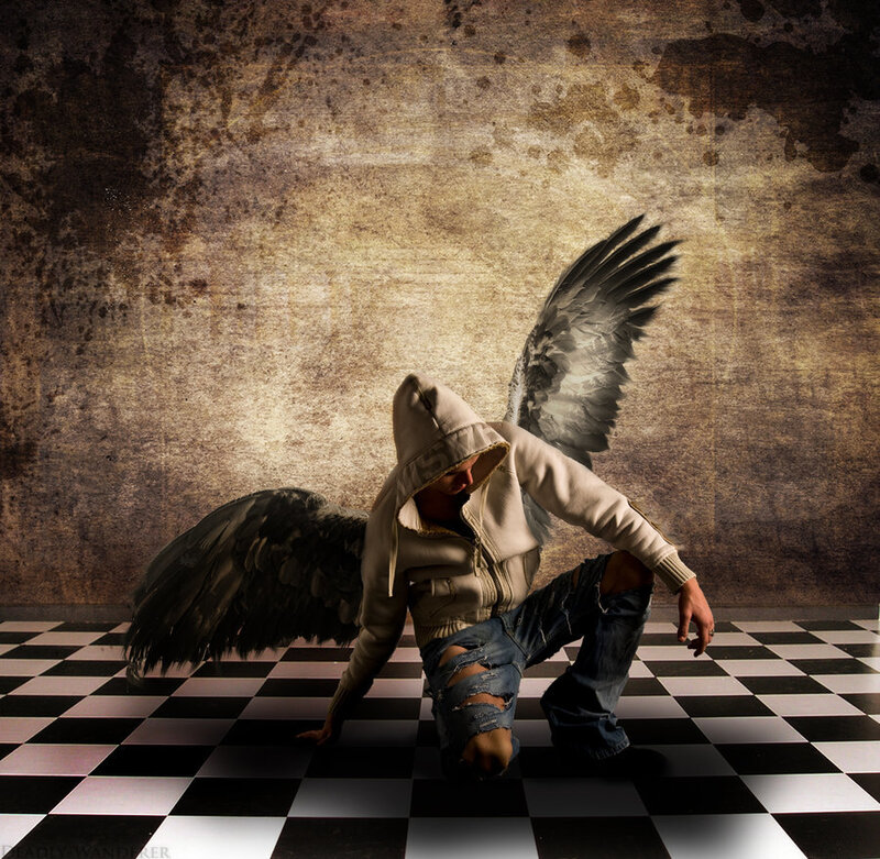 angel with wings on checkered floor