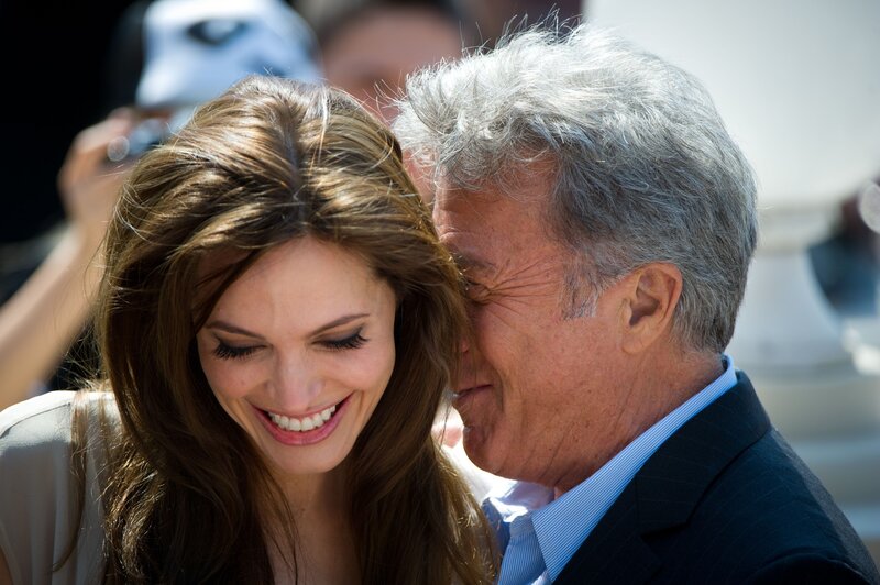 Angelina Jolie and a man smiling