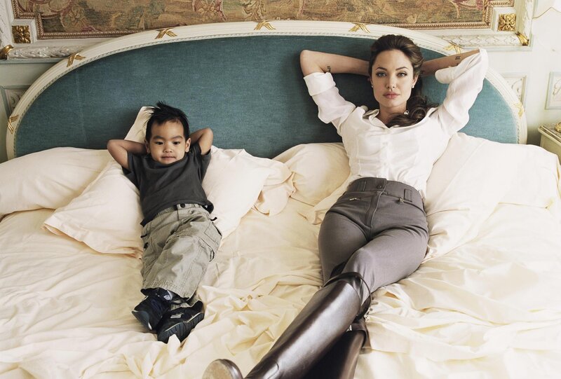 Angelina Jolie and son on a bed