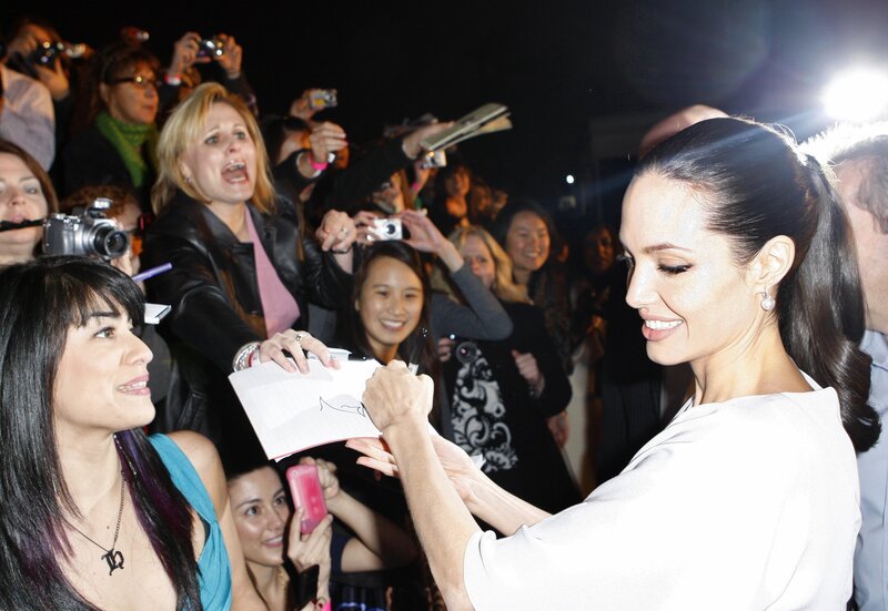 Angelina Jolie signing autographs