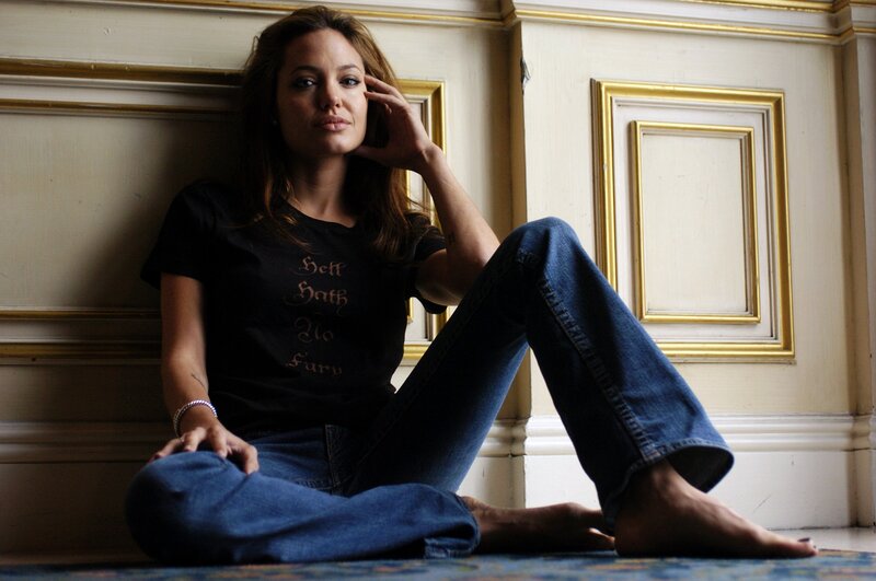 Angelina Jolie sitting on floor