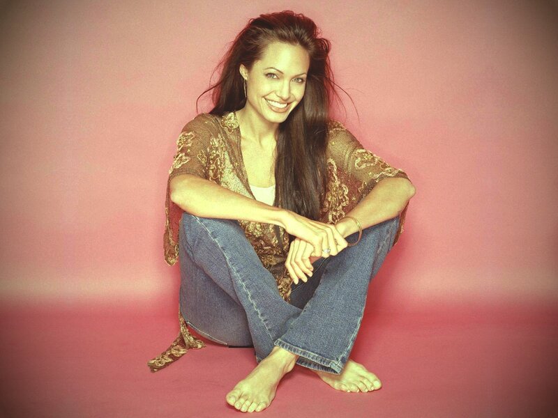 Angelina Jolie sitting on floor