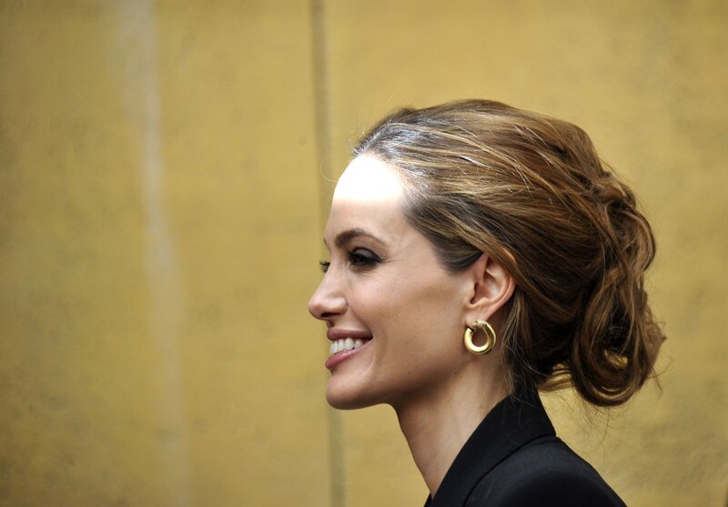 Angelina Jolie smiling in profile