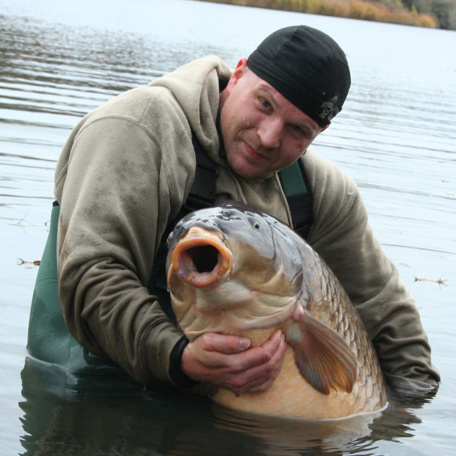 angler with large carp