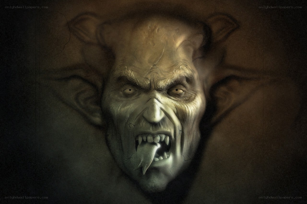angry demon face carving