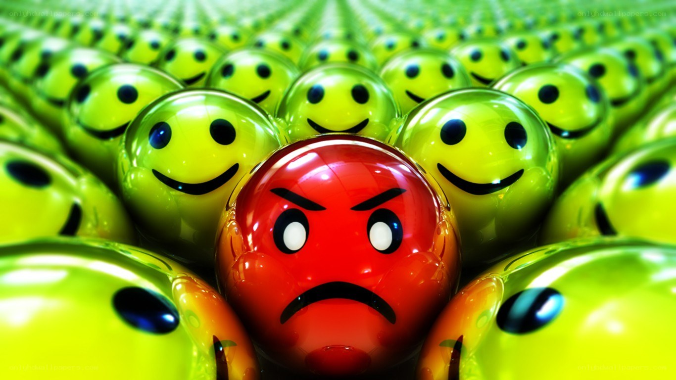 angry face among smiling faces