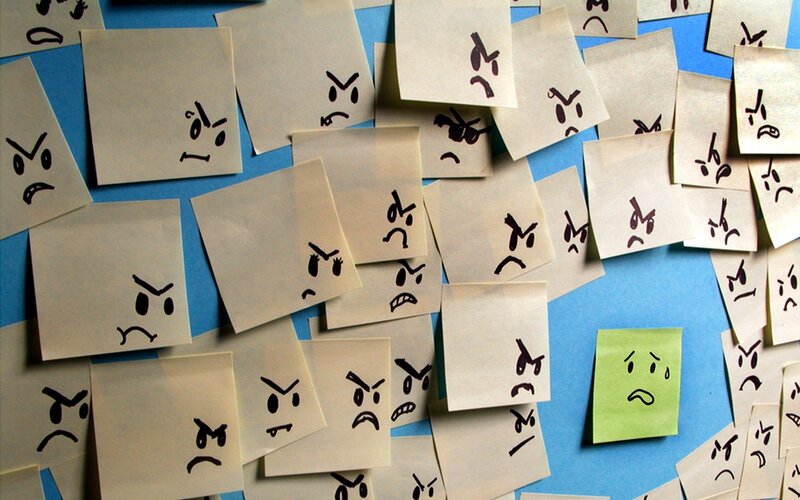 angry faces on sticky notes
