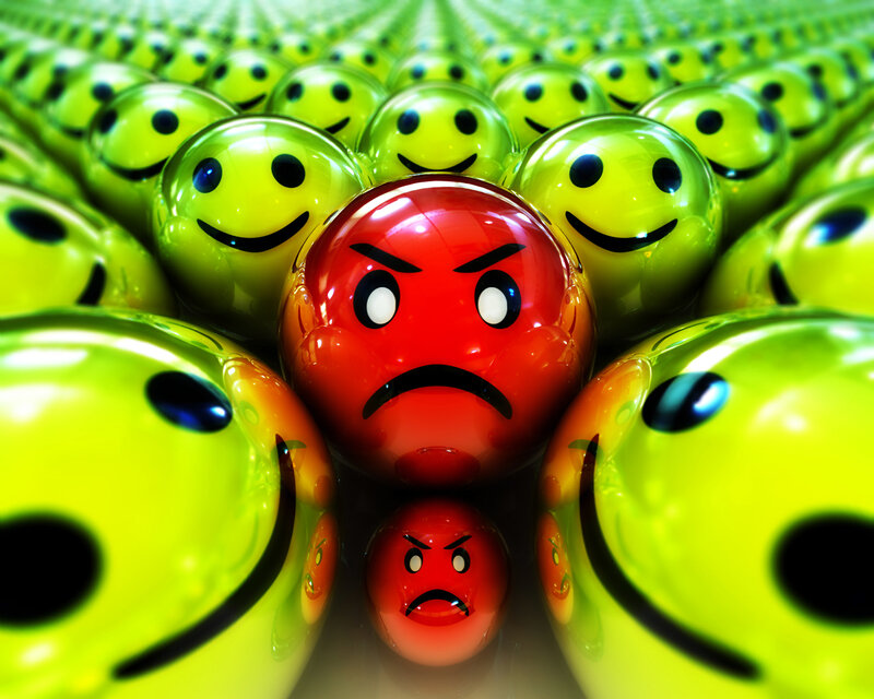 angry red ball among green smileys