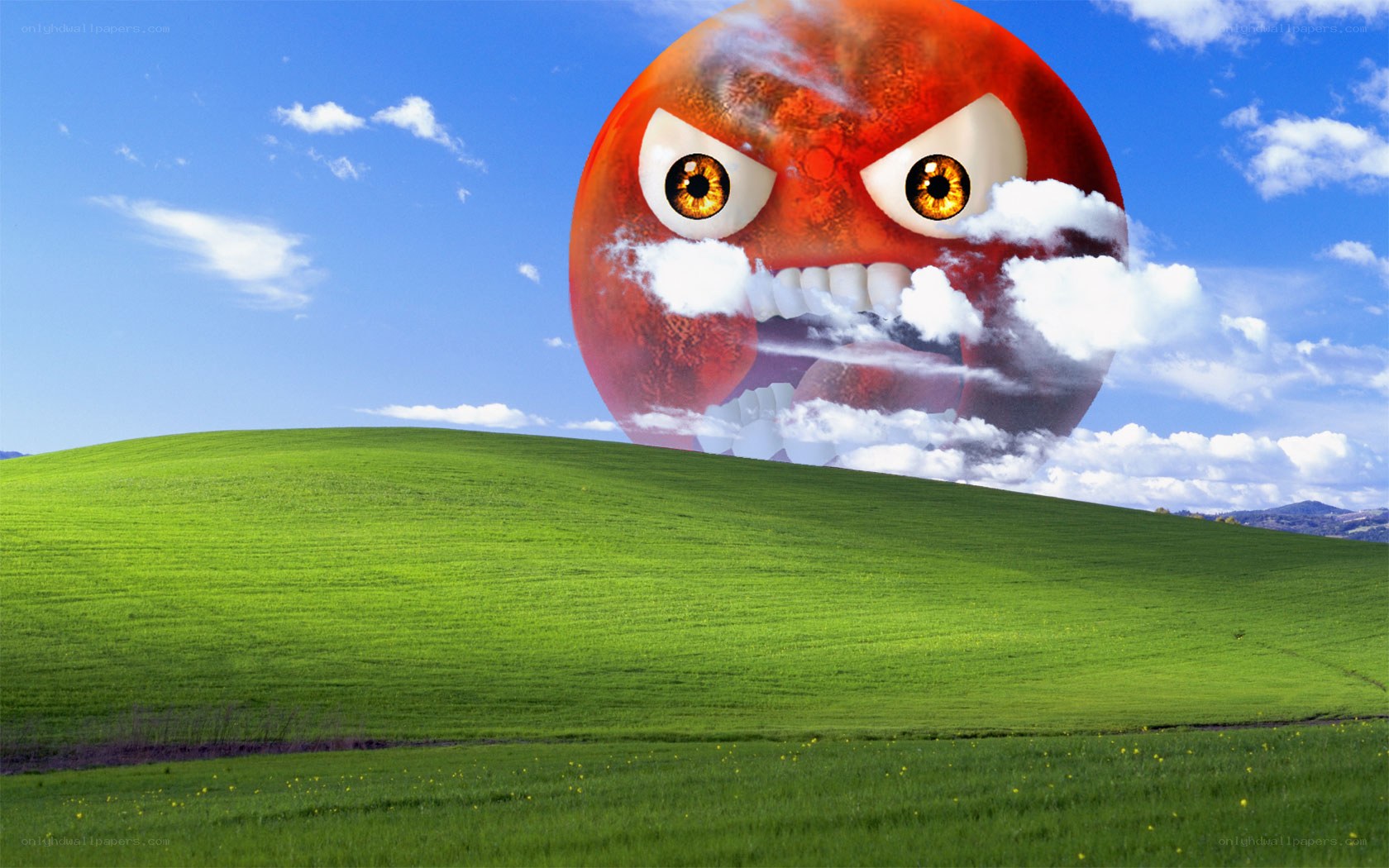 angry sun over green hills