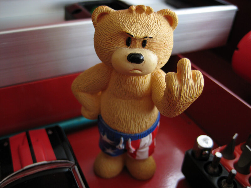 angry teddy bear figurine