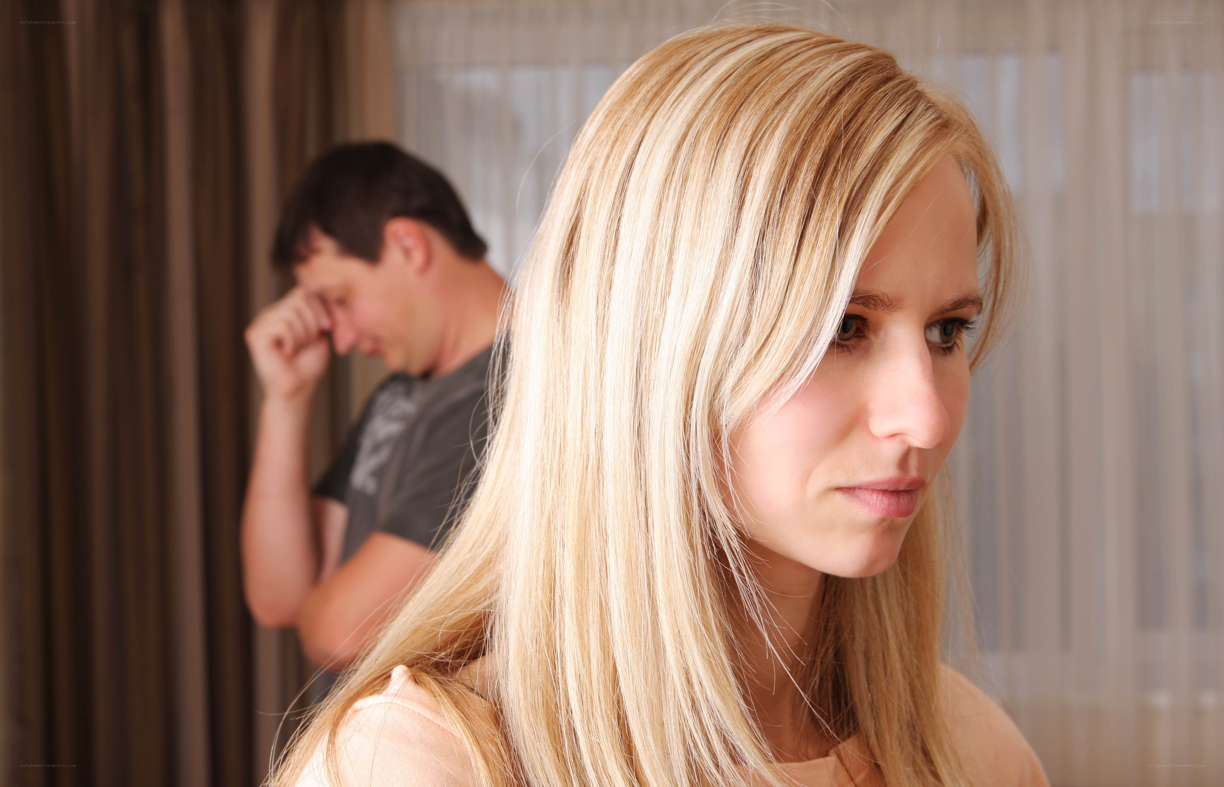 angry woman with man in background