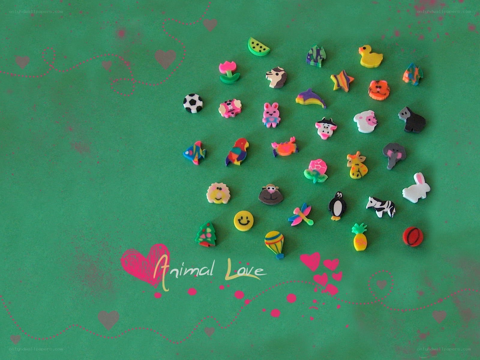 Animal-themed erasers on green