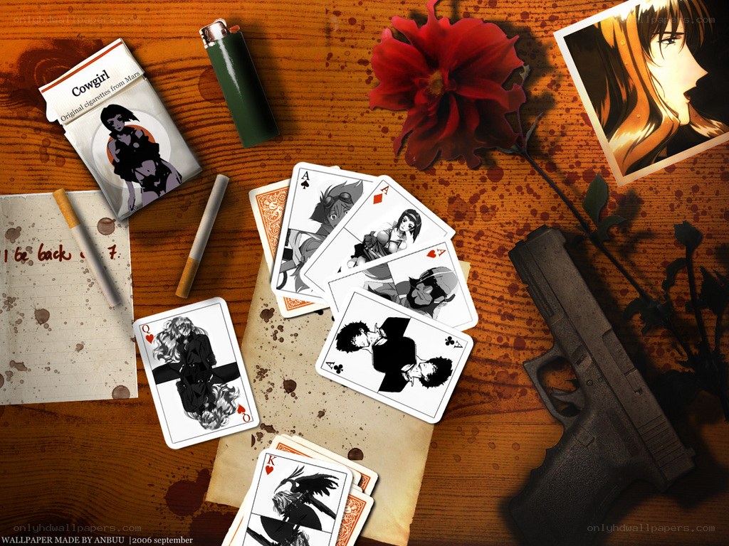 Anime cards and gun on table
