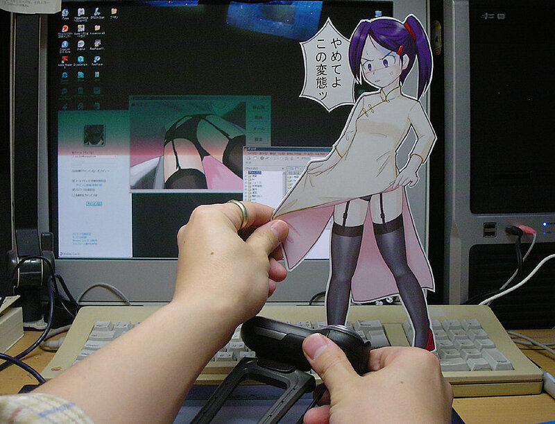 anime character cutout at desk