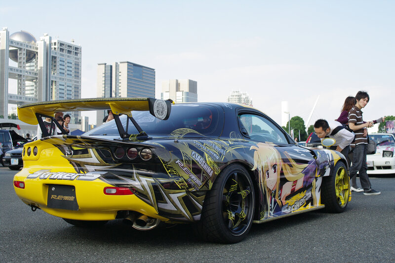 Anime-decorated sports car at show