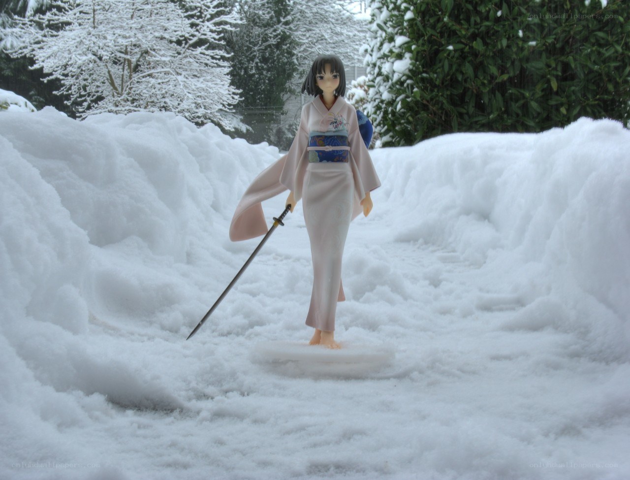 Anime figure in snowy garden