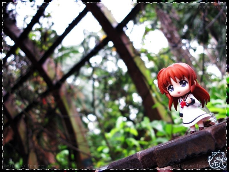 Anime figure on a garden ledge