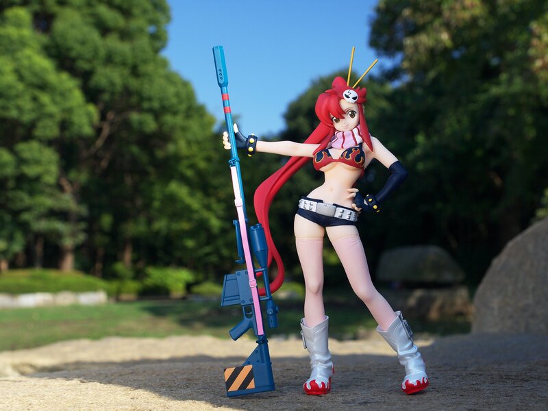 Anime figure with rifle in park