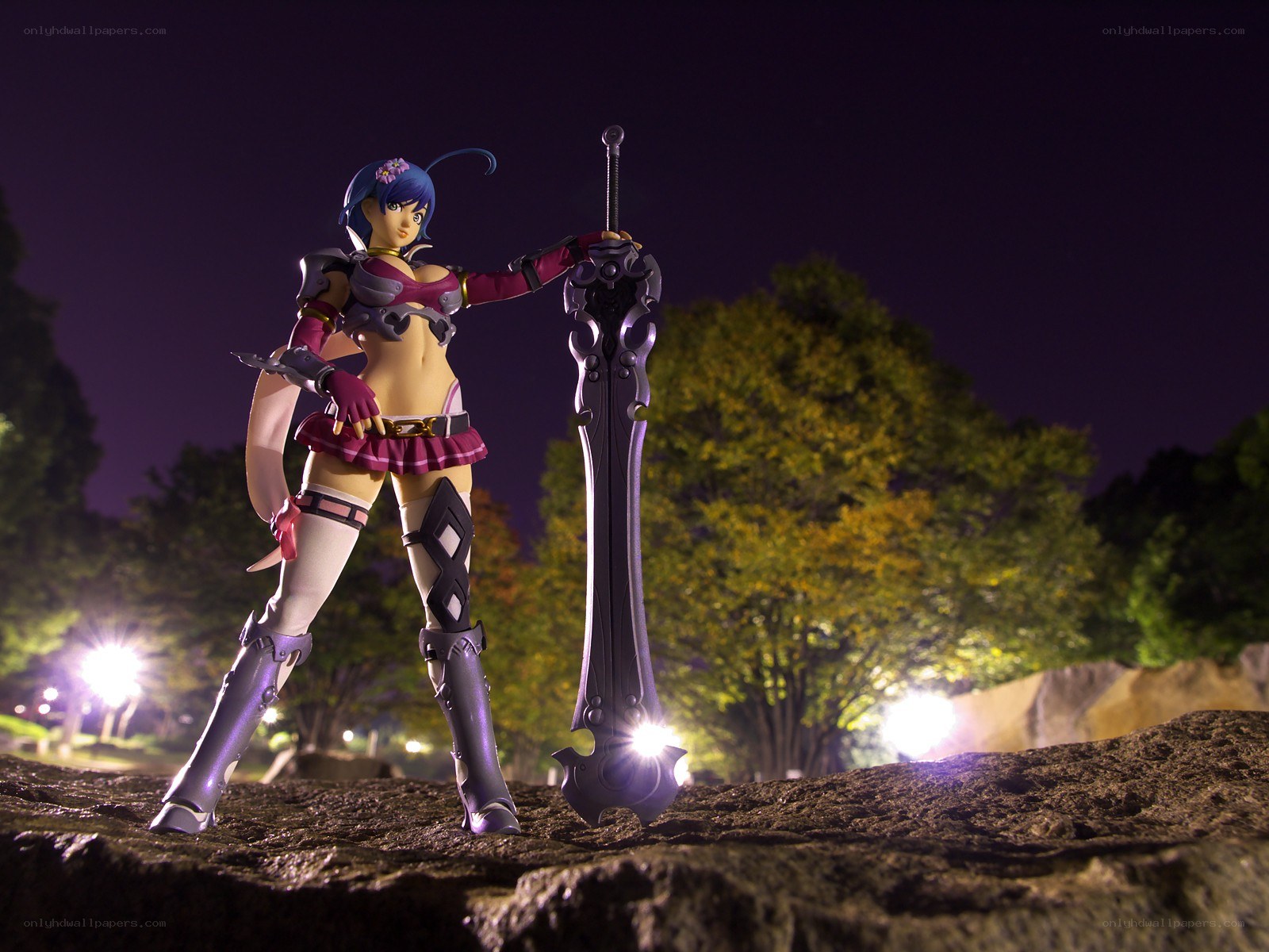 Anime figure with sword at night