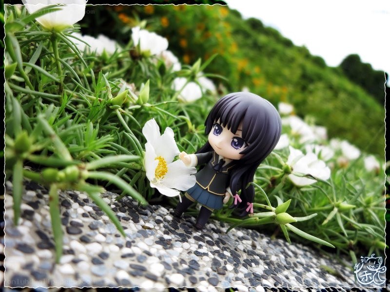 Anime figure with white flower