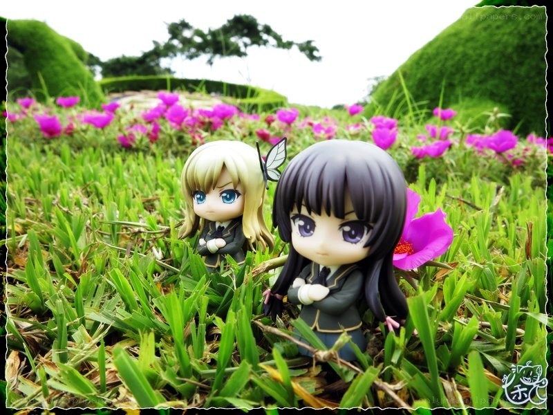 Anime figures in a flower garden
